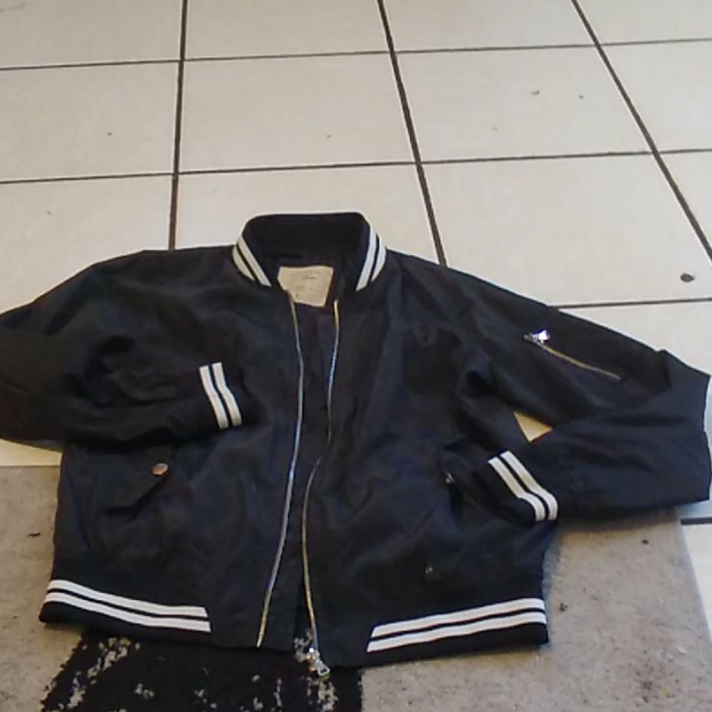 Size L black with varsity striped jacket
